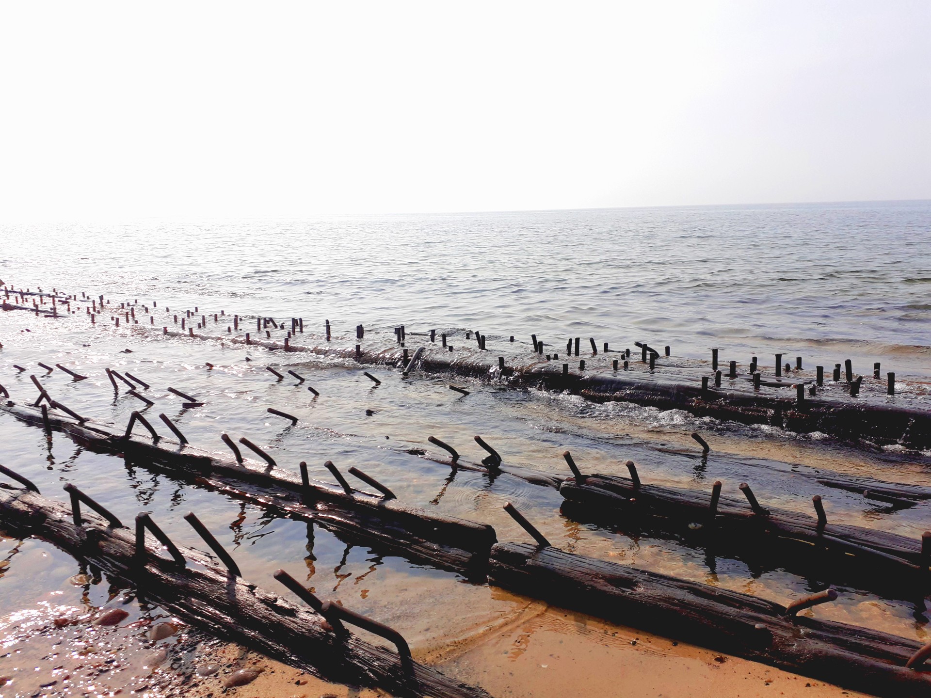 shipwreck poking through the sand of Lake Superior