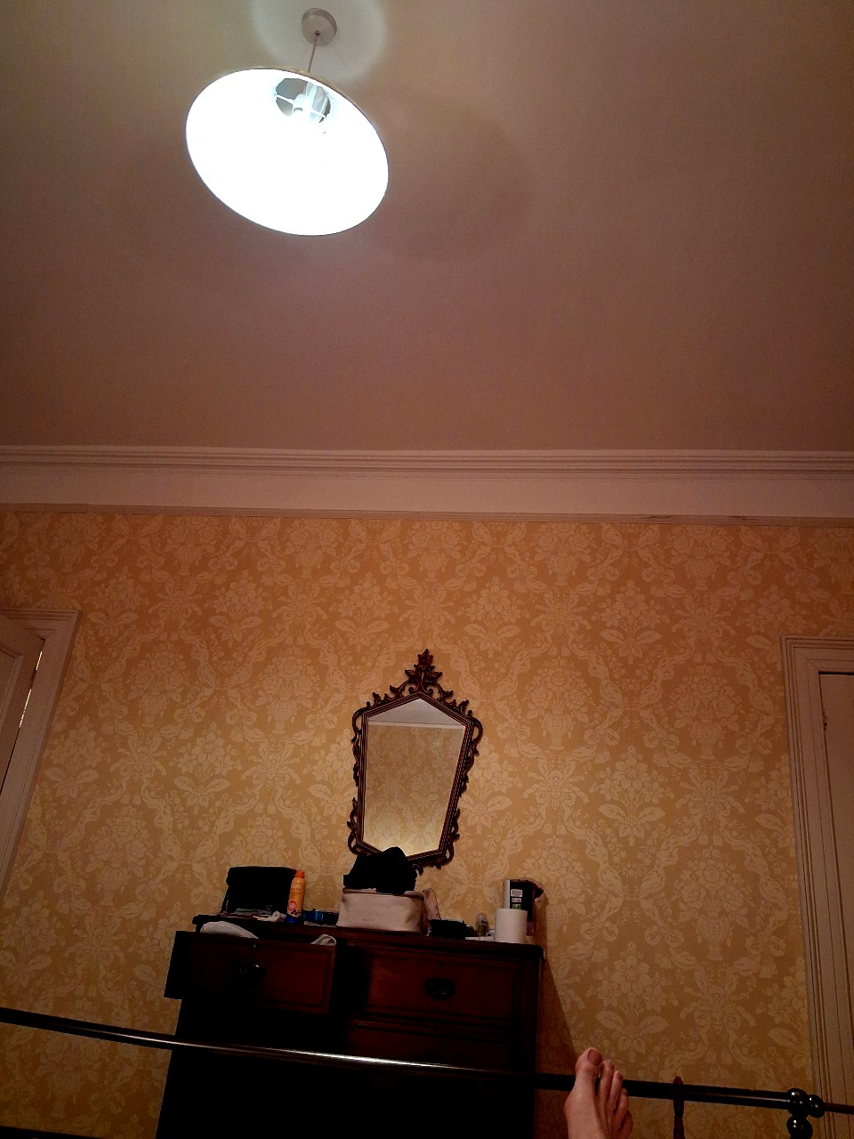 feet at the end of a bed